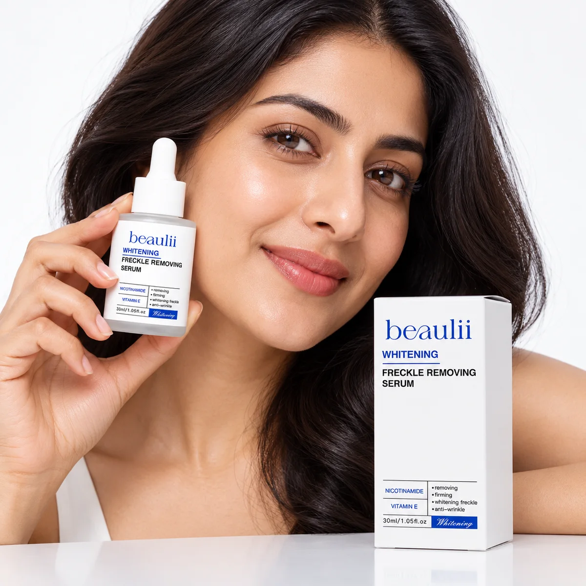 Woman holding Beaulii Whitening Freckle Removing Serum for freckles and dark spots